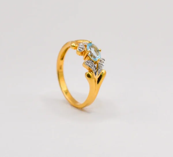 Guld Ring med blå sten