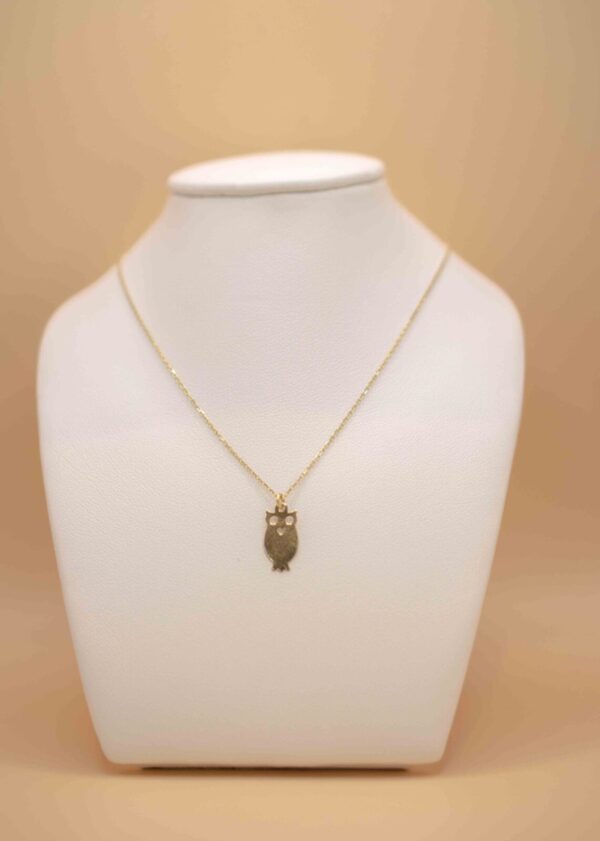 Halsband med fågel berlock